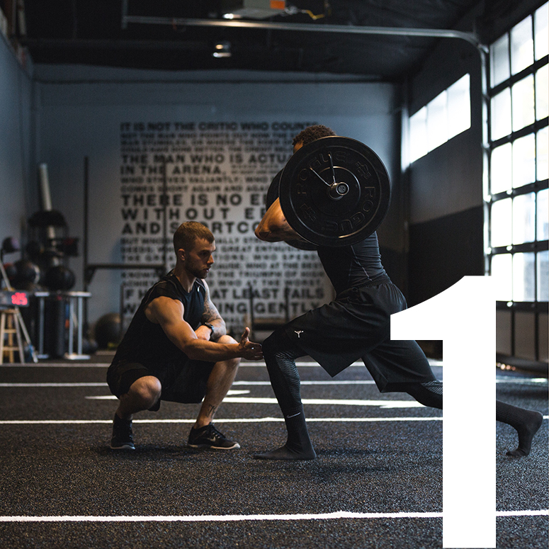 Personal Trainer Helping a Man Train