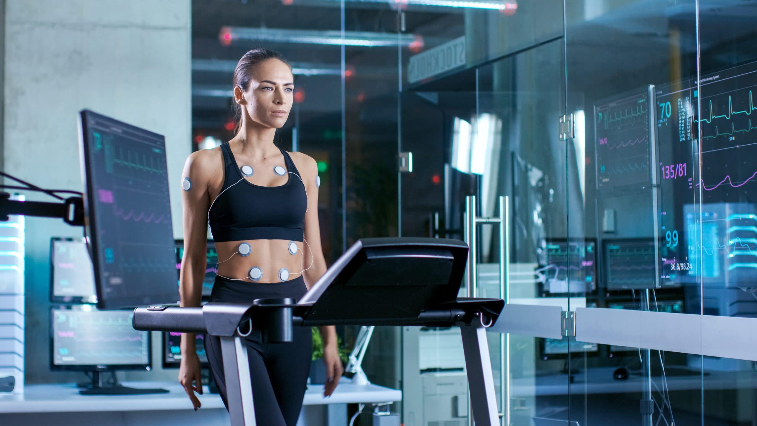 Women walking on treadmill, in laboratory testing metabolic rate