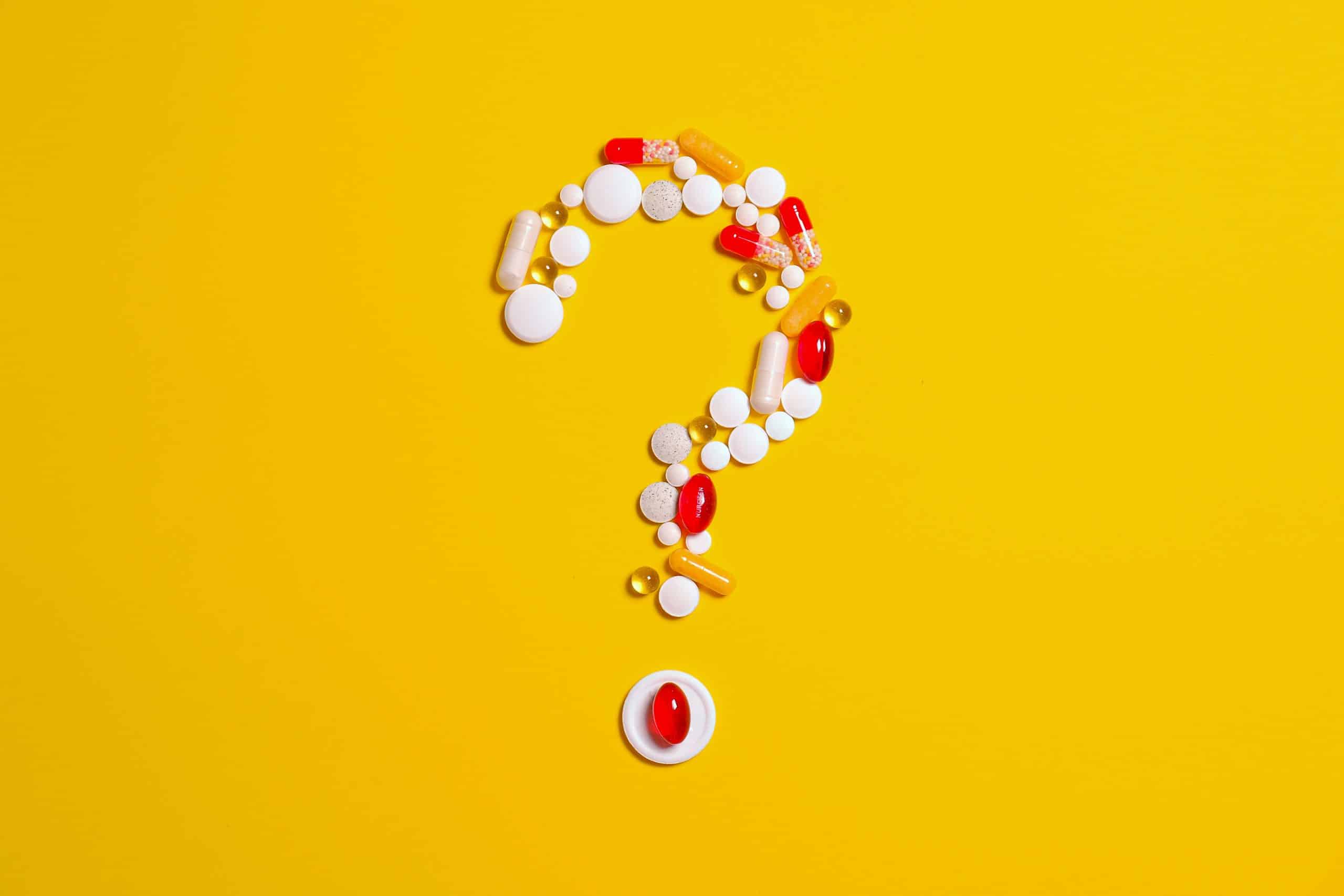 Vitamins shaped as a question mark