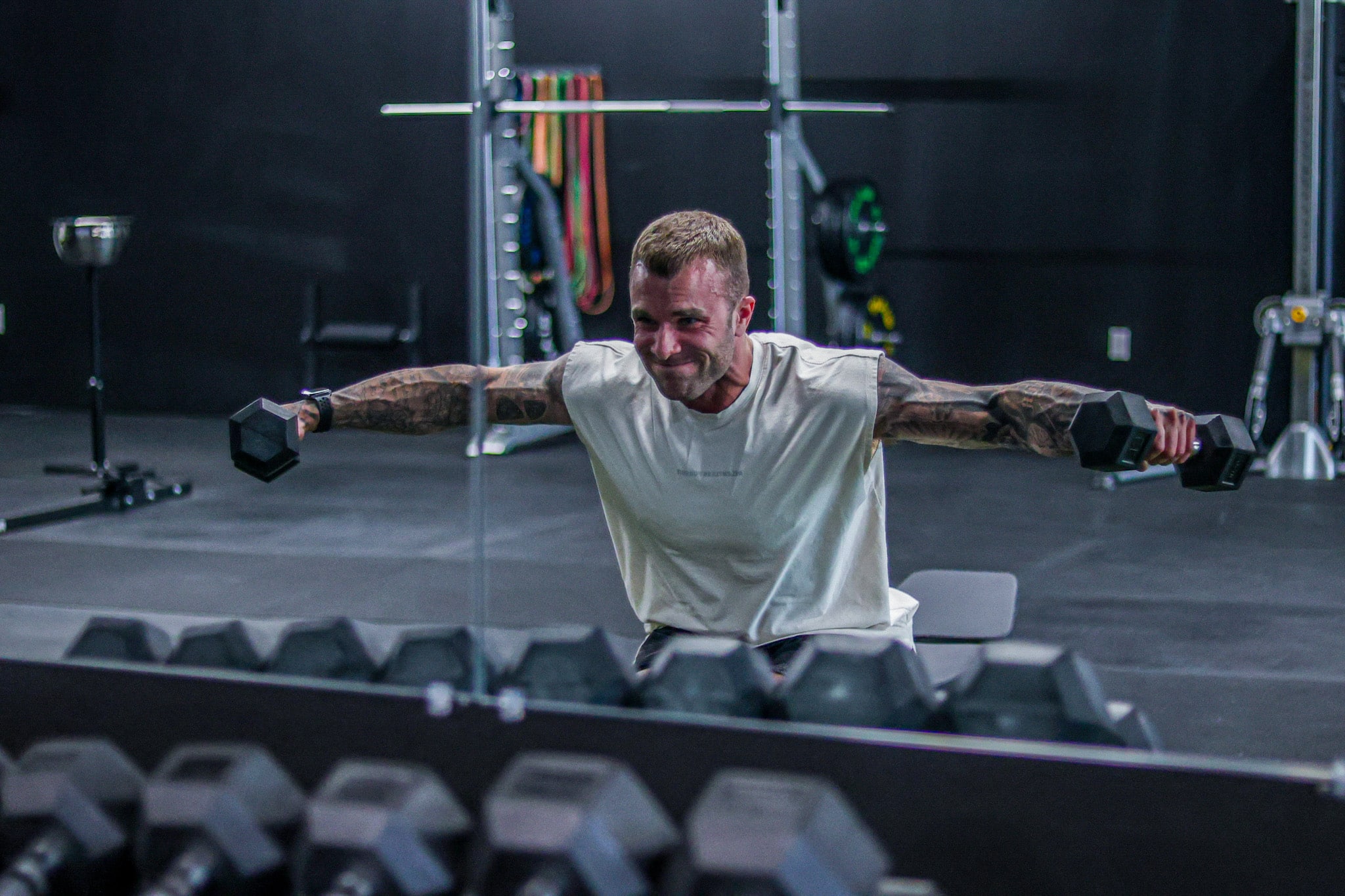 Cody McBroom performing lateral raises