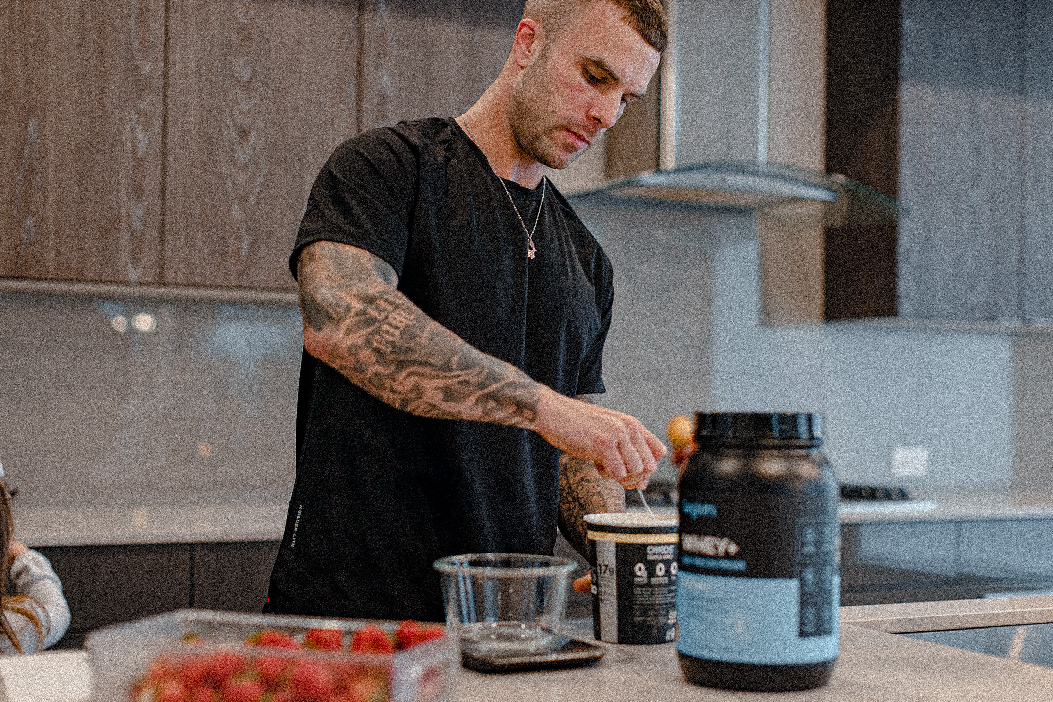 Cody McBroom making overnight oats, using Legion whey protein and oikos triple zero yogurt.