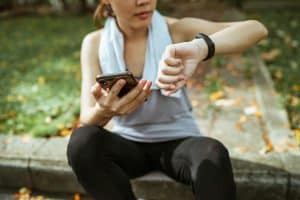Woman checks her heart rate monitor