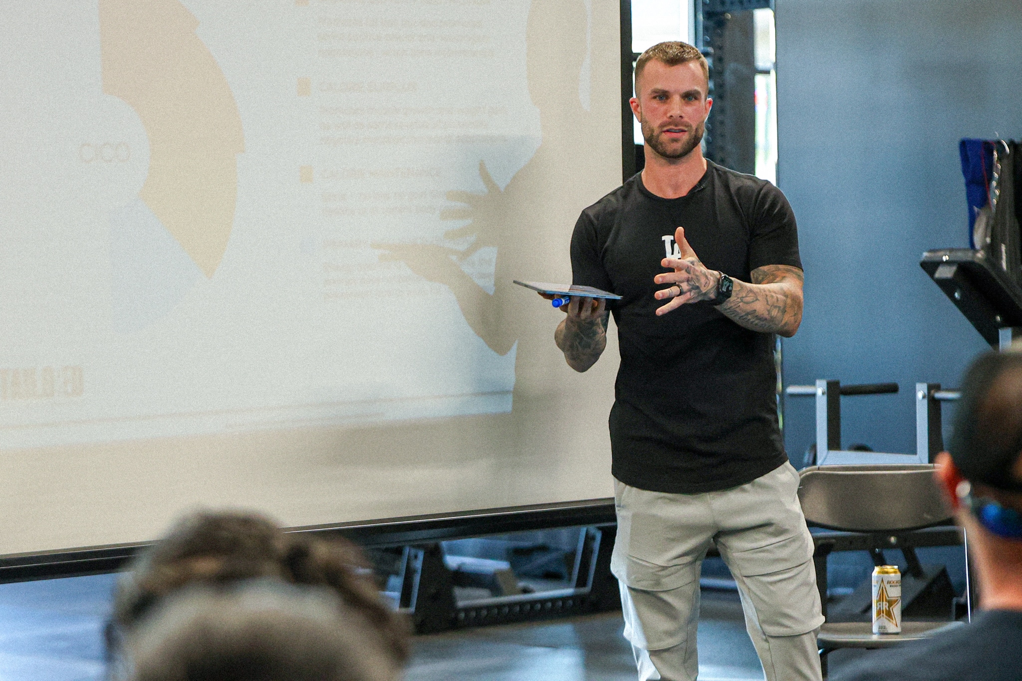 Cody McBroom, CEO and Founder of Tailored Coaching Method, teaching clients the Tailored Transformation System at a Workshop at the TCM headquarters in Buckley/Bonney Lake WA