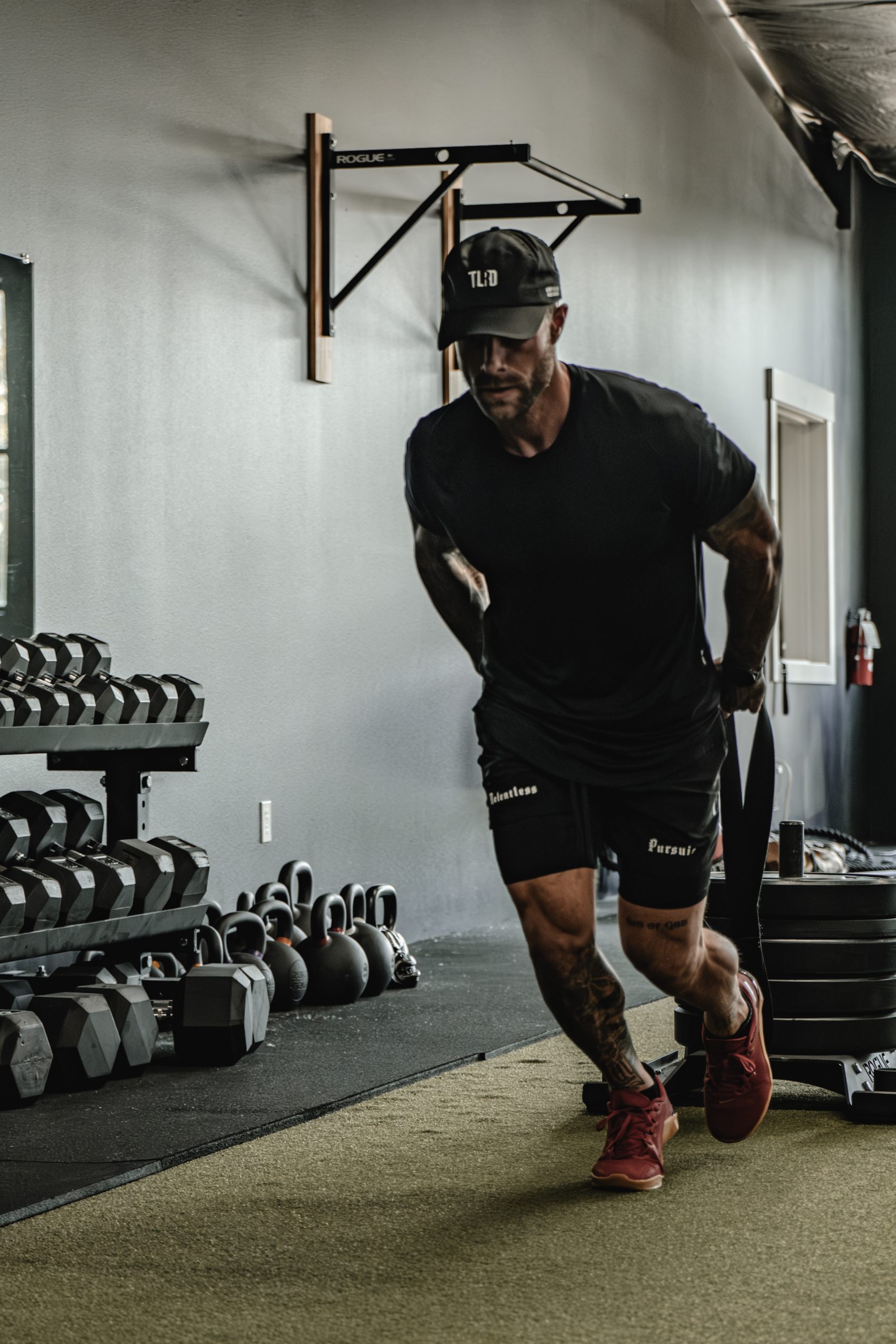 Cody McBroom of Tailored Coaching Method performing sled drags