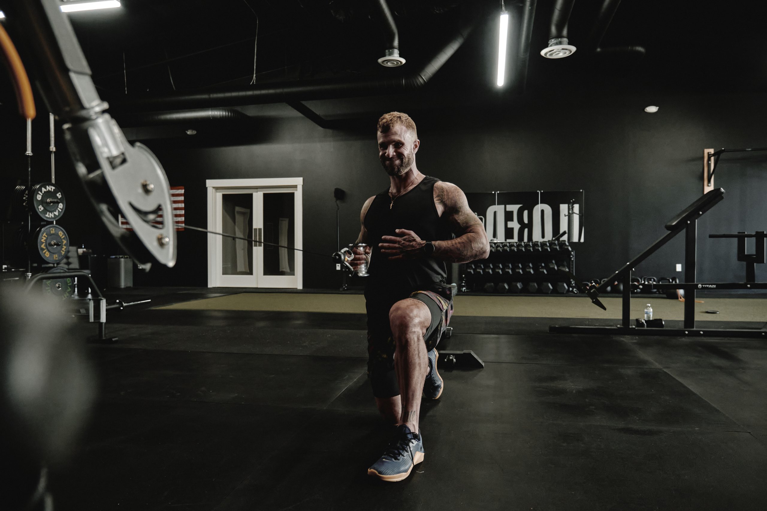 Cody McBroom, founder of Tailored Coaching Method, training in the gym.
