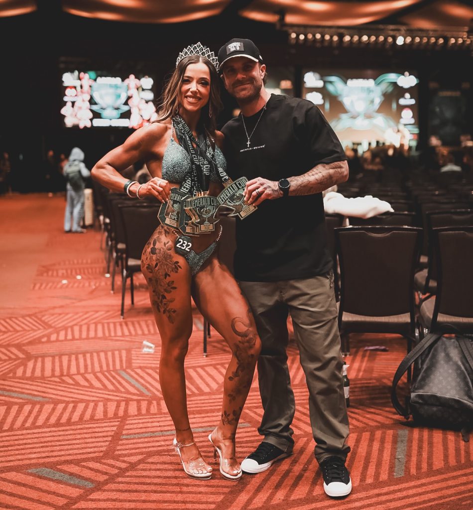 Coach Cody McBroom, founder of Tailored Coaching Method, with his client Kimi Girmus at Emerald Cup 2026, where she won 6 medals across Bikini and Wellness Physique Competition Categories.