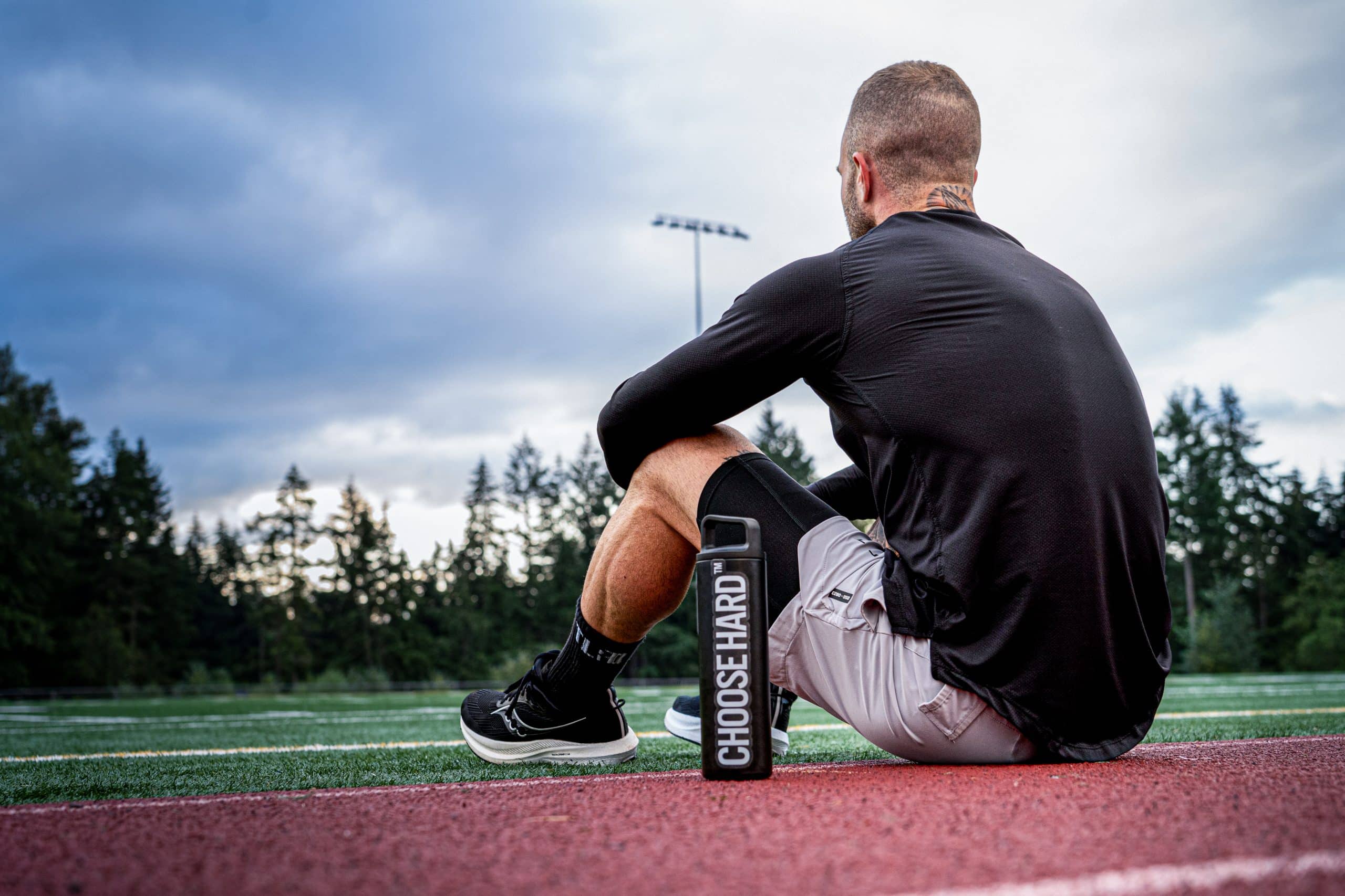 Athlete taking intra-workout carbohydrate fluid during a hybrid training session
