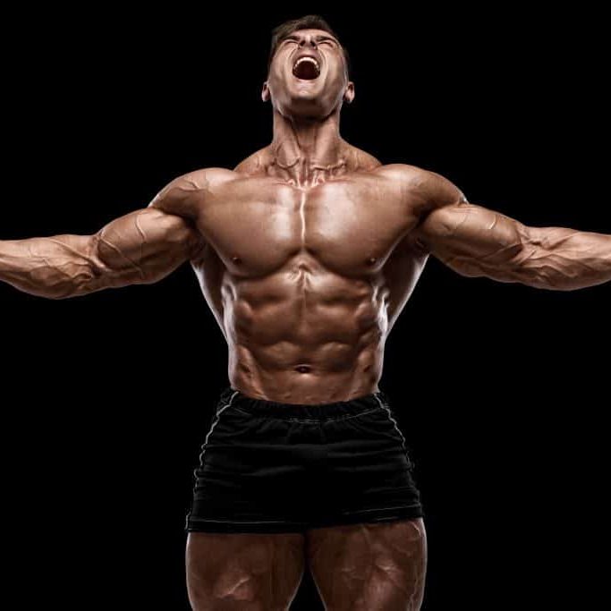 Muscular,Man,Showing,Muscles,Isolated,On,The,Black,Background.,Strong